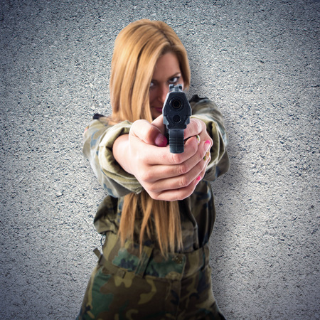 Military woman with gunの写真素材