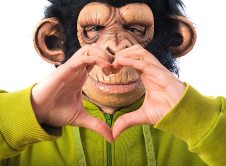 Monkey man making a heart with his hands