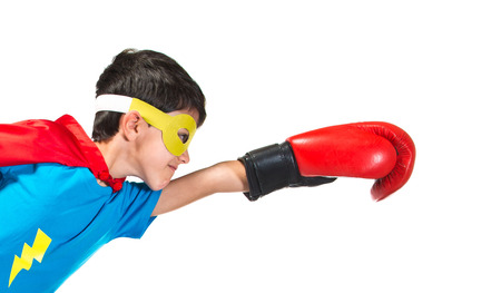 Child dressed like superhero with boxing glovesの写真素材