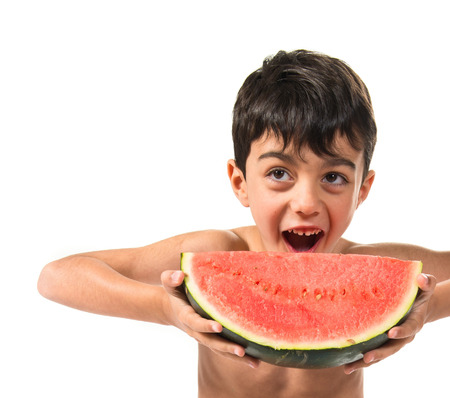 Child eating a watermelonの写真素材