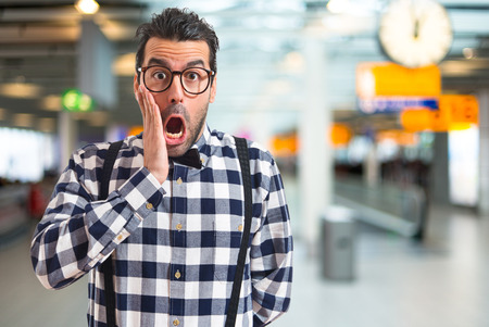 Posh boy doing surprise gestureの写真素材