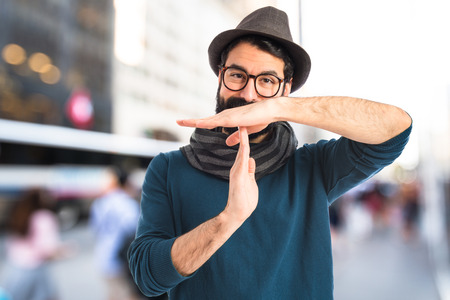 bohemian man making time out gestureの写真素材