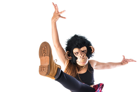 Woman with monkey mask dancingの写真素材