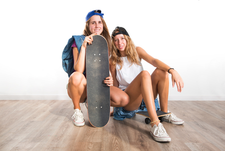 Two friends with their skateboardsの写真素材