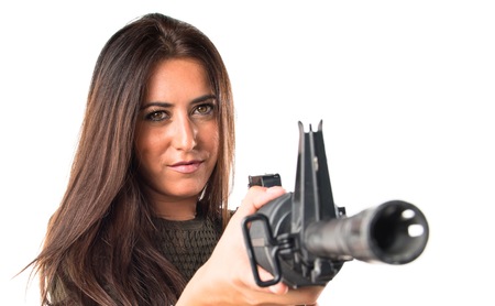 Woman shouting a SMGの写真素材