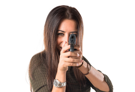 woman shooting with a pistolの写真素材