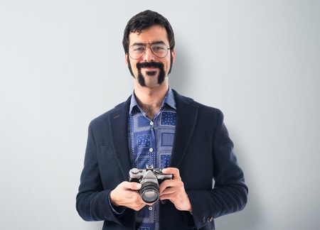 Vintage young man with cameraの写真素材