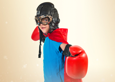 Child dressed like superhero with boxing glovesの写真素材