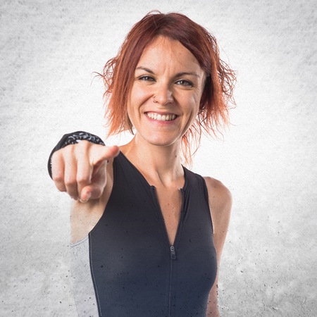 Woman pointing to the frontの写真素材