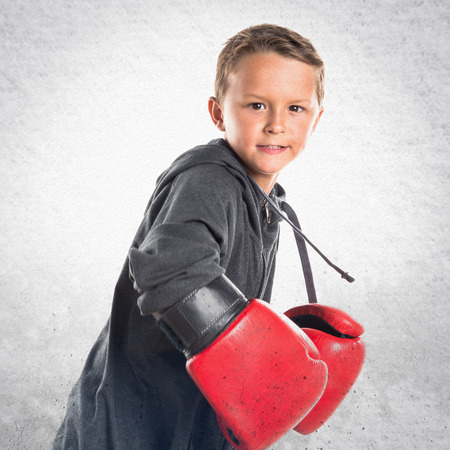 Kid with boxing glovesの写真素材