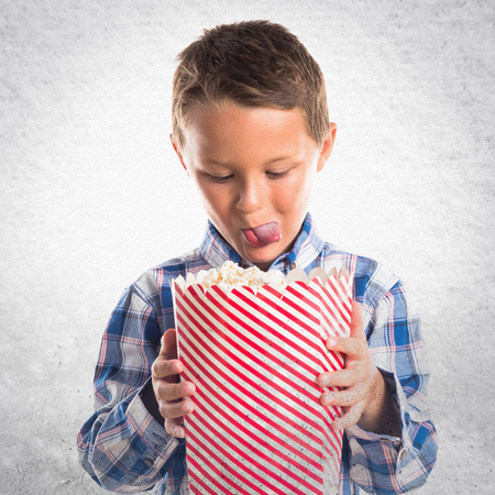 Kid with popcornの写真素材