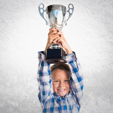 Kid holding a trophyの写真素材