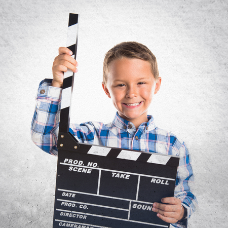 Kid holding a clapperboardの写真素材