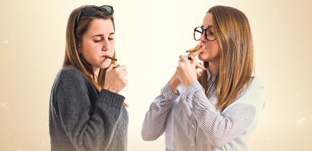 Twin sisters smokingの写真素材