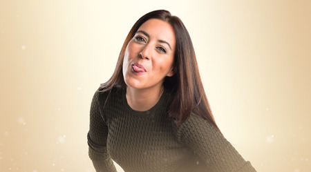 woman taking out her tongueの写真素材