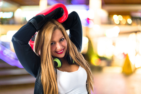 Blonde girl with boxing glovesの写真素材