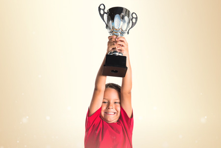 Kid holding a trophyの写真素材