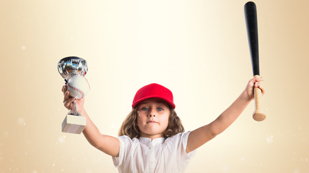 Girl playing baseballの写真素材
