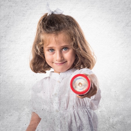 Girl holding a flashlightの写真素材