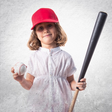Girl playing baseballの写真素材
