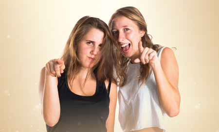 Girls pointing to the frontの写真素材