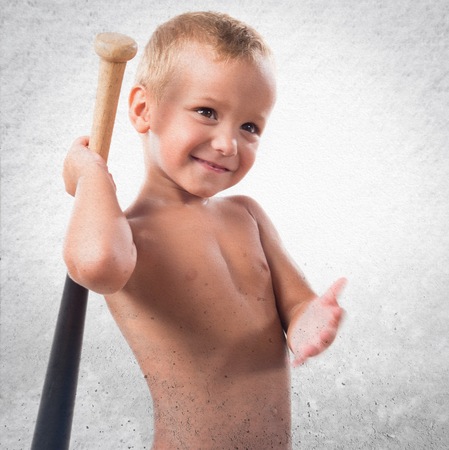 Kid playing baseballの写真素材