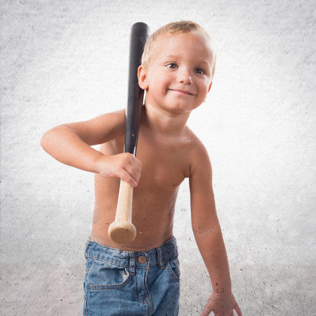 Kid playing baseballの写真素材