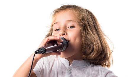 Girl singing with microphoneの写真素材