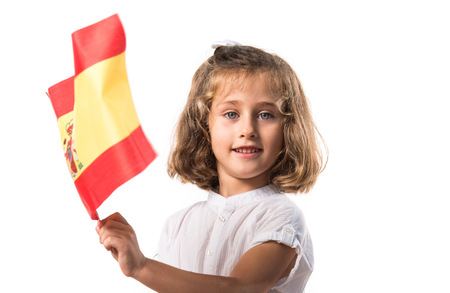 Kid holding a spanish flagの写真素材
