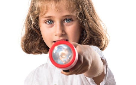 Girl holding a flashlightの写真素材