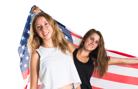 Friends holding an american flagの写真素材