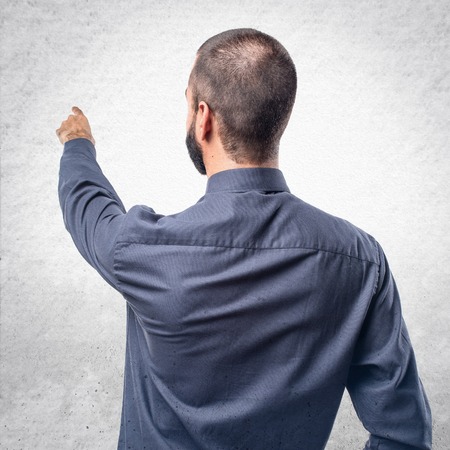 Man pointing backの写真素材