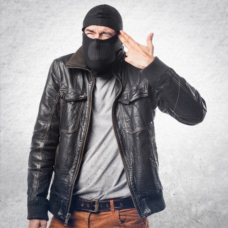 Robber making gun gestureの写真素材