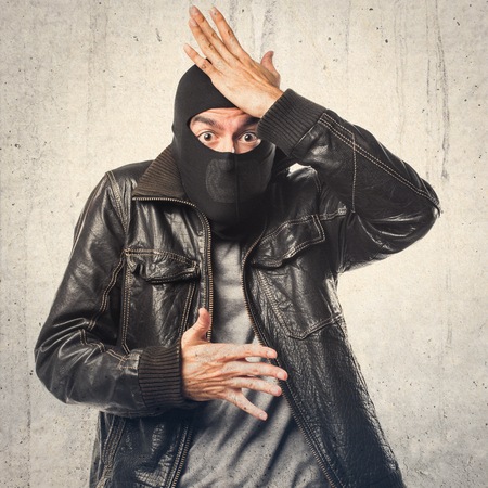 Robber having doubtsの写真素材