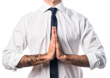 Businessman in zen positionの写真素材