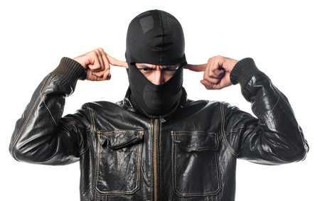 Robber covering his earsの写真素材