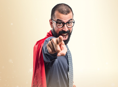 Super hero pointing to the frontの写真素材