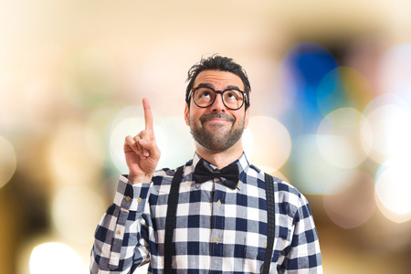 Posh boy pointing upの写真素材