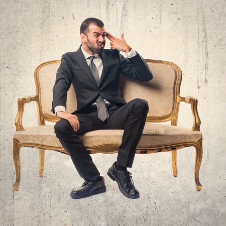 Businessman making gun gestureの写真素材