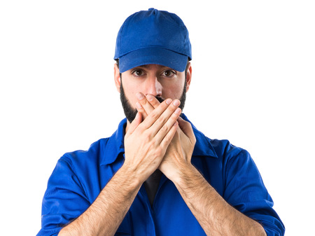 Plumber covering his mouthの写真素材