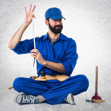 Plumber with bevel mowerの写真素材