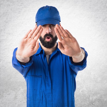 Plumber making stop signの写真素材