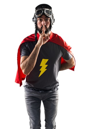 Superhero making silence gestureの写真素材