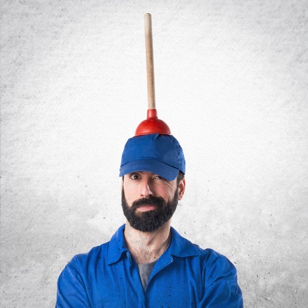 Plumber holding a plungerの写真素材