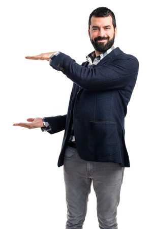 Handsome man holding somethingの写真素材