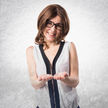 Brunette woman holding somethingの写真素材