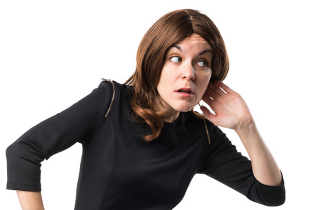 Brunette woman listening somethingの写真素材