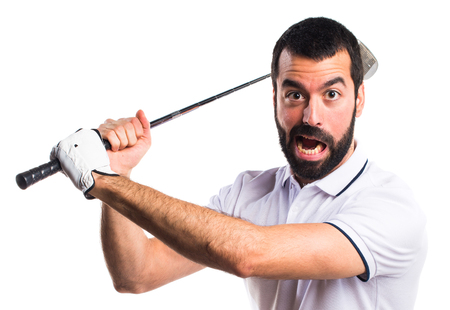 Golfer giving a hitの写真素材
