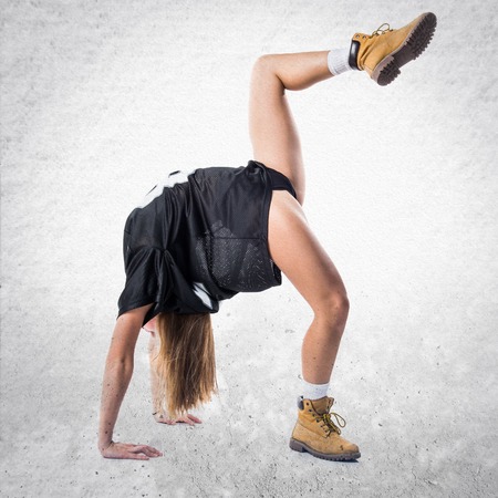 Blonde woman dancing street danceの写真素材