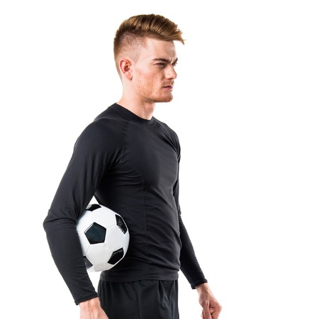 Man holding a soccer ballの写真素材